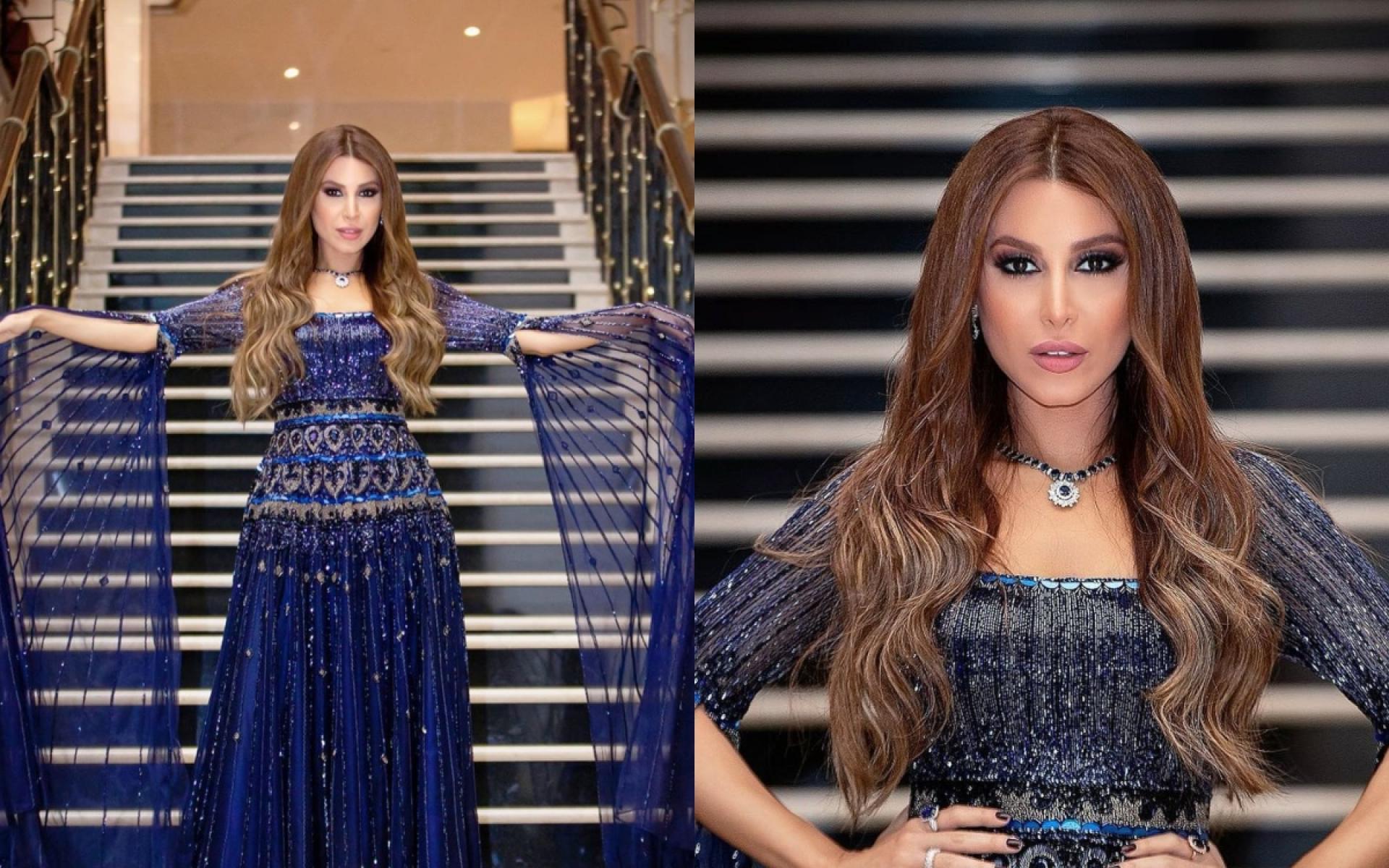 فستان باللون الأزرق ميزه الشيفون الذي غطى الذراع